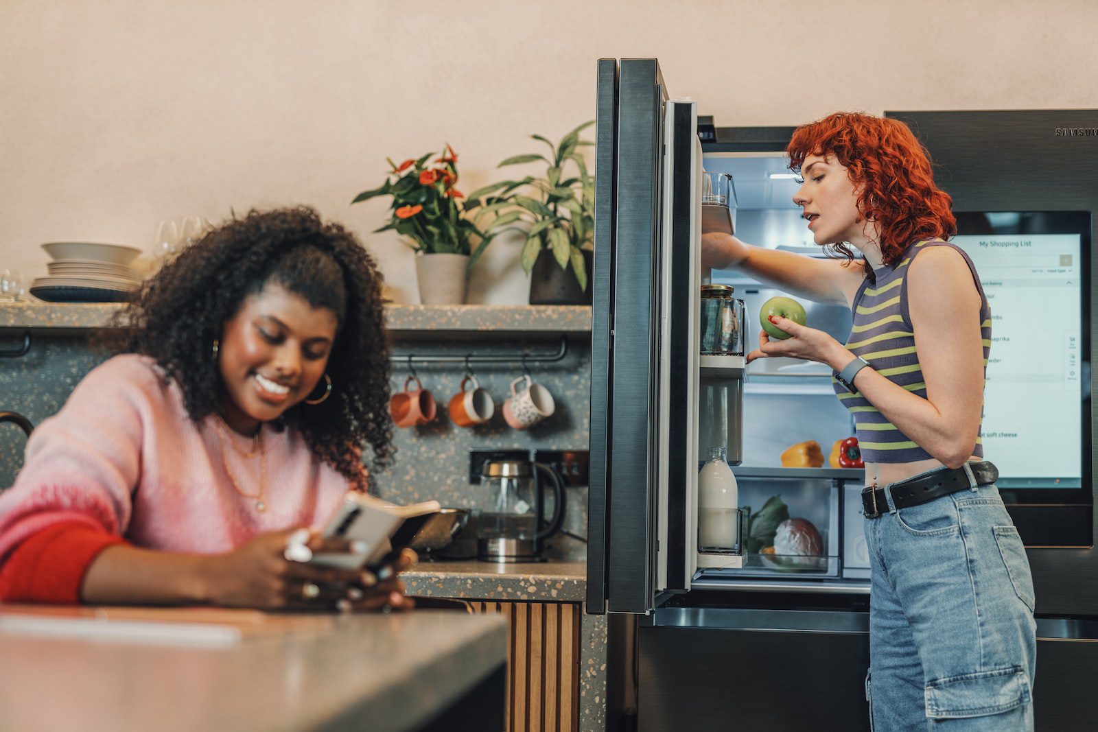 A person looking at a person in a kitchen