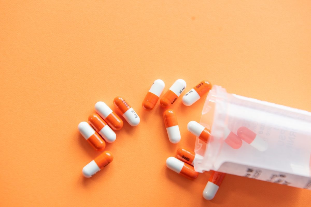 Orange and white medication pill pharmaceutical