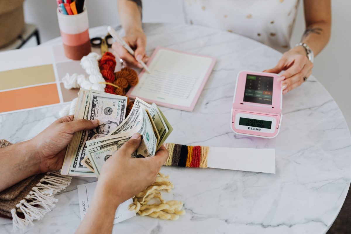 personal finances Hands Holding US Dollar Bills